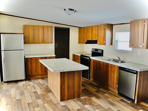 New Kitchen with island, lots of counter space.