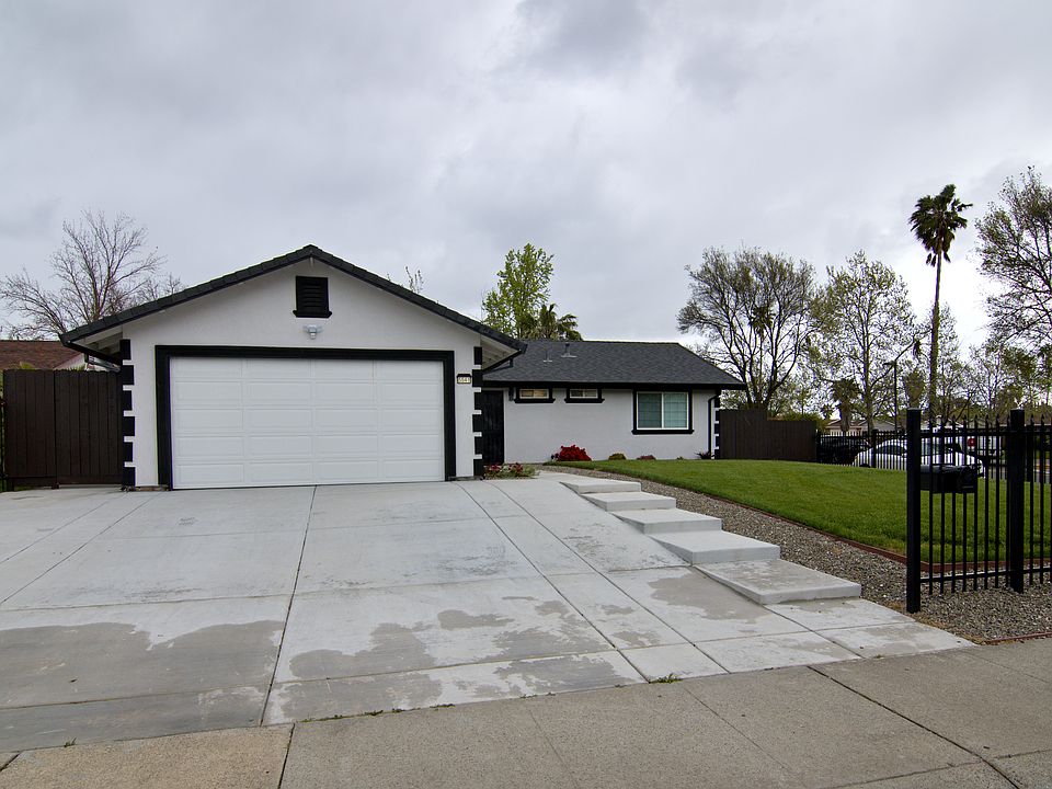 Beautifully landscaped front yard and looking at the front of the house