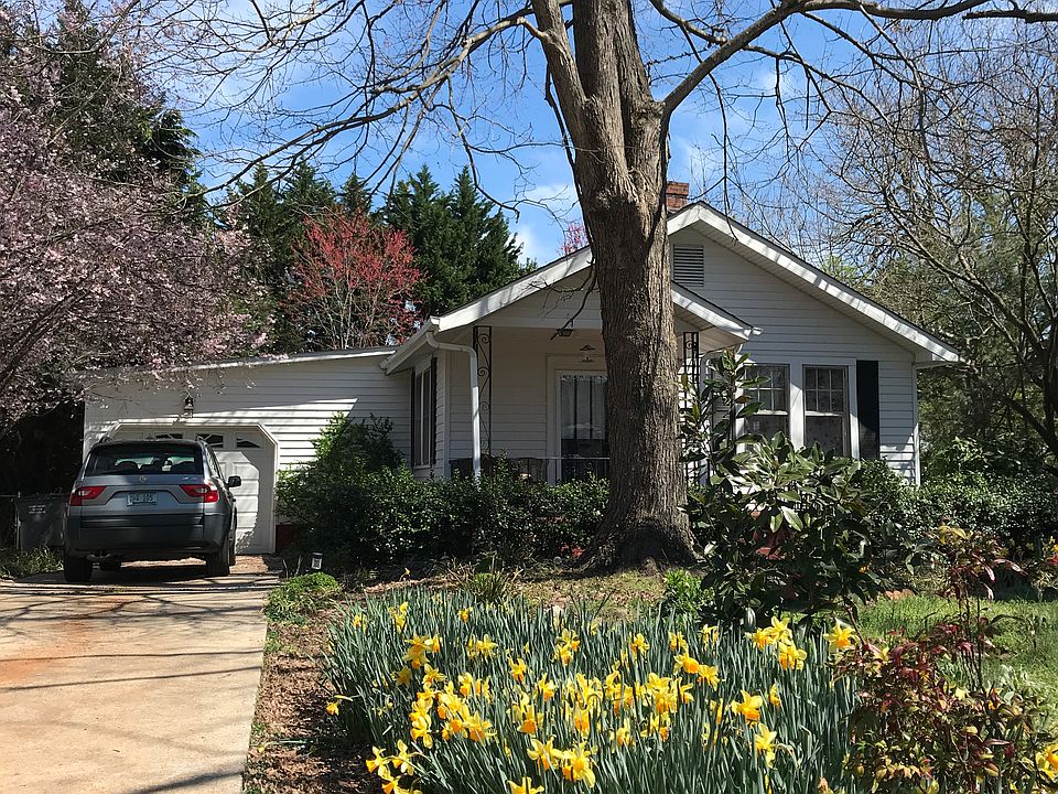 Tons of flowers line the level driveway in spring. That Lil' Gem Magnolia is over 20'tall and perfumes the yard in spring.