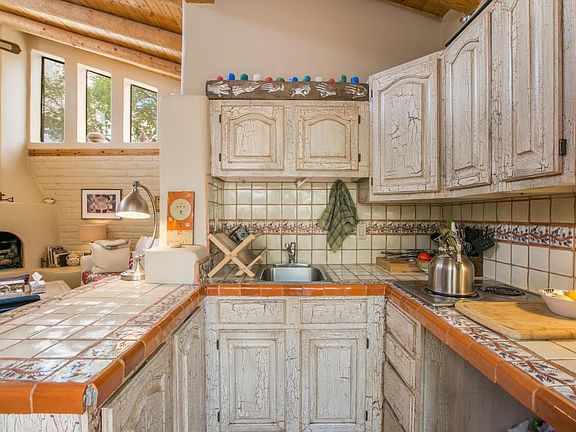 Nice compact kitchen with adjacent pantry.
