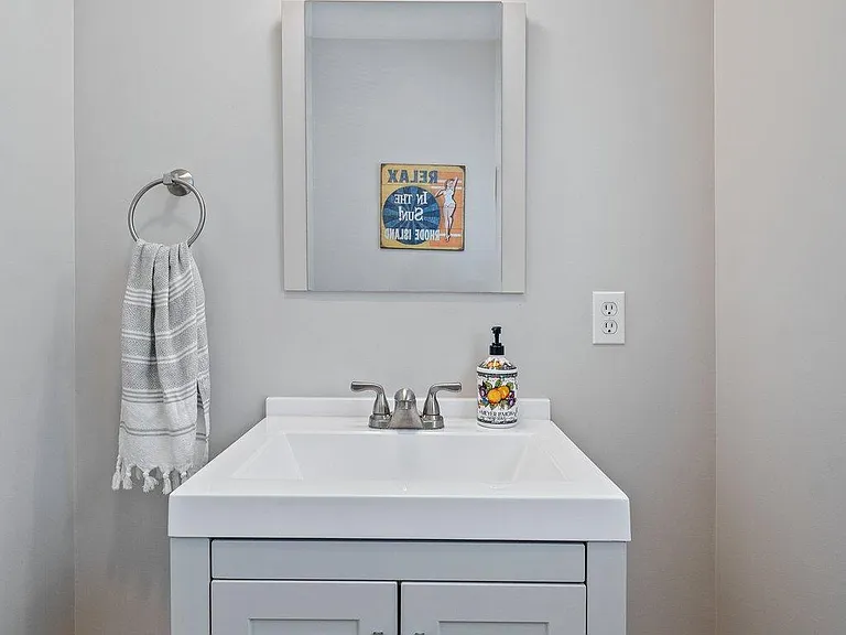Downstairs powder room, off of kitchen eating area.