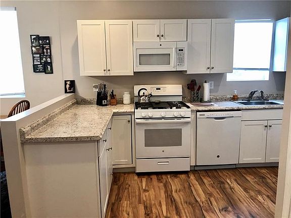 Open kitchen with plenty of storage.