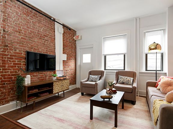 4 Bedroom Living Room with Exposed Brick