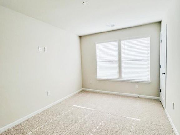 The room on the first floor with a full bathroom, could be a studio or a bedroom.