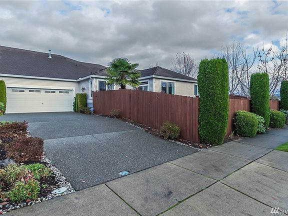 Driveway, huge 2 car garage and a fully fenced backyard.
