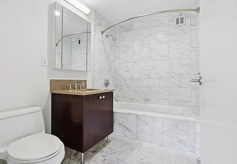 Indulge in the elegance of Arbor's modern bathroom featuring sleek marble finishes and a spacious layout. Enjoy a perfect blend of style and comfort that enhances your daily routine. Explore your new sanctuary today!