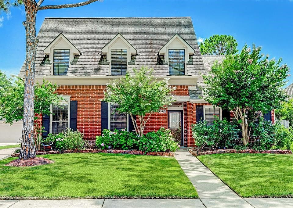Village Built Home With A Welcome Home Feeling!  Lush Landscaping*Storm Door*Lead Glass Front Door.