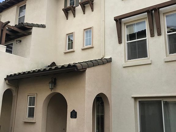 Front view of the townhome with front patio area