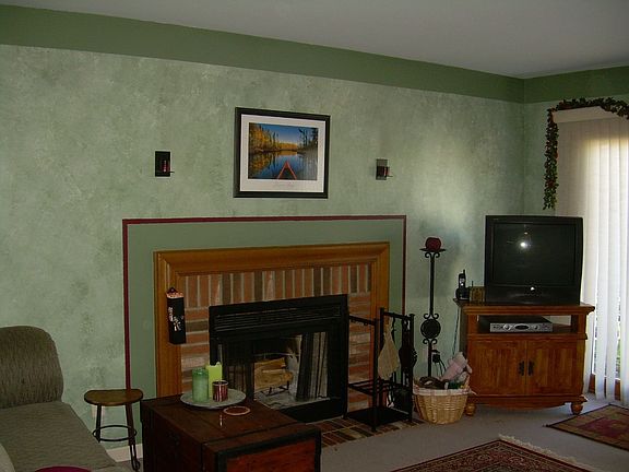 Living Room w/ Brick Fireplace
