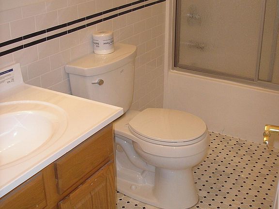 the bathroom has full bathtub