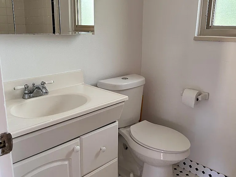 Upstairs bathroom has full tub