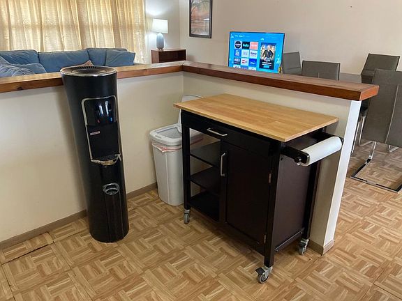 Kitchen Cart for Added Storage and Counter Space and water fountain (tenant needs to provide water, this can be stored elsewhere. if tenant does not want to use it)