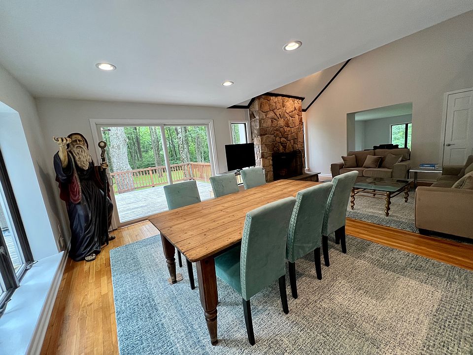 Casual dining area in the keeping/family room, back of the house off the massive wrap around deck
