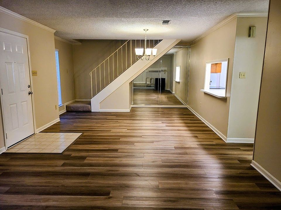 Front Entrance to View From Living Room to Dining Room and Kitchen Casement