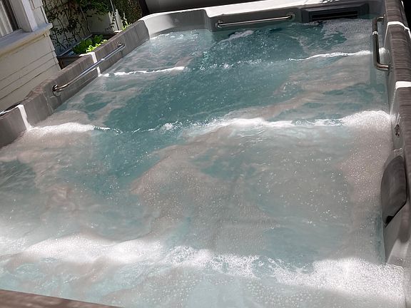 Swimspa five jetted spa seats and two swim jets with swim tether provided (not pictured)