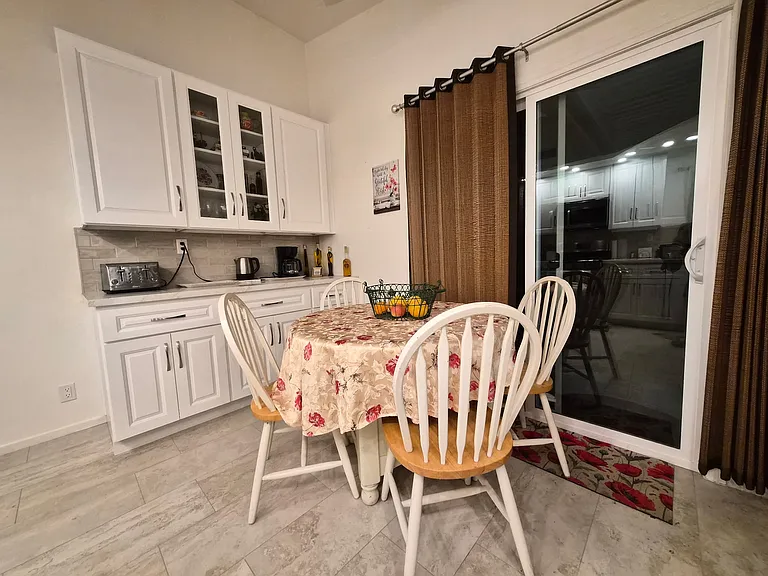 breakfast prep area with coffee/tea bar in the eating area