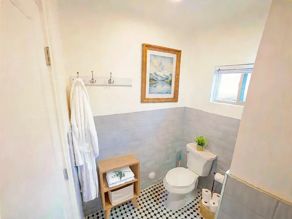 Full bathroom with walk-in shower. (Furnished for display)