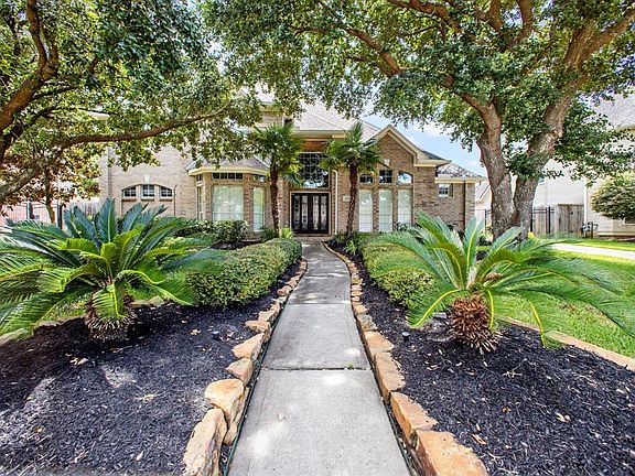 Beautifully landscaped with sprinkler system