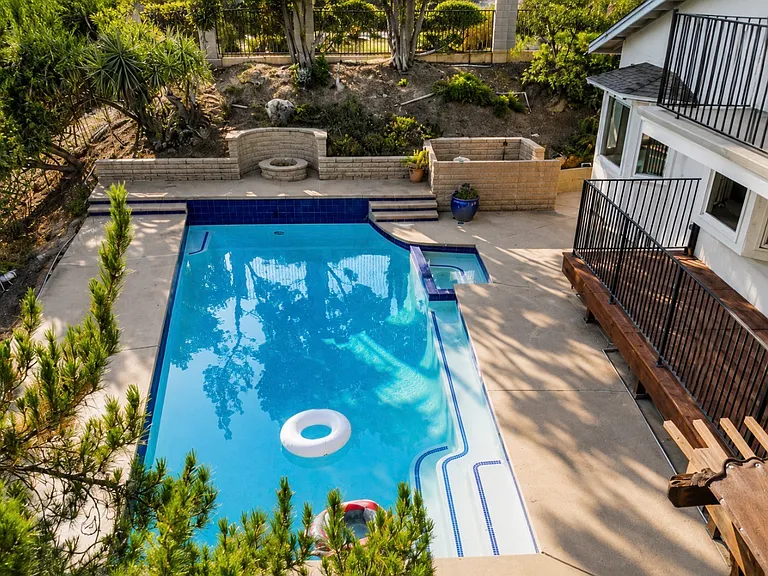 Pool area backyard with a deck