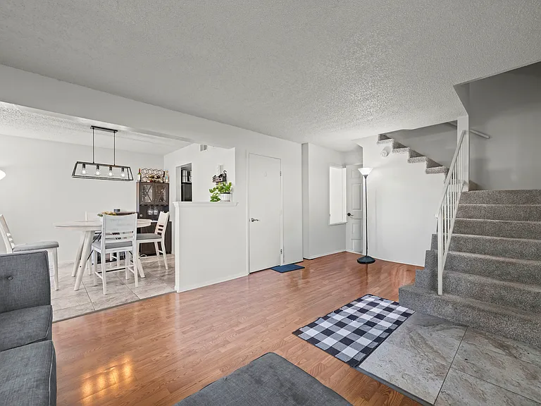 Bright and inviting living room featuring abundant natural light and an open layout ideal for everyday living and entertaining.