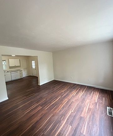 Large living room with new flooring.