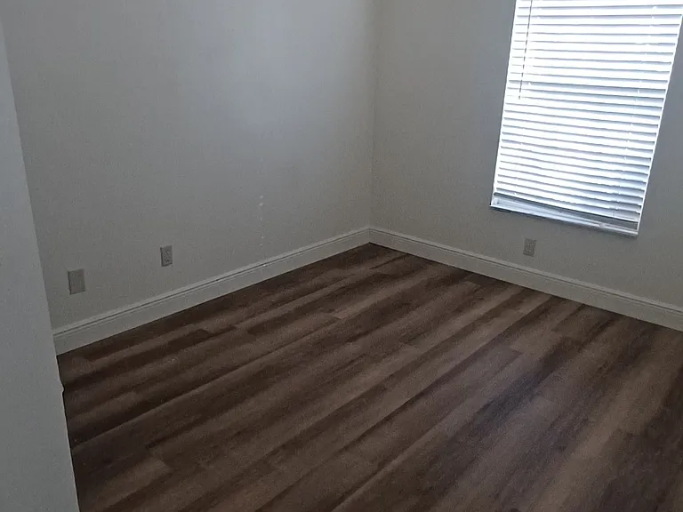 Bedroom 3, located at front on home. Make s a great home office.