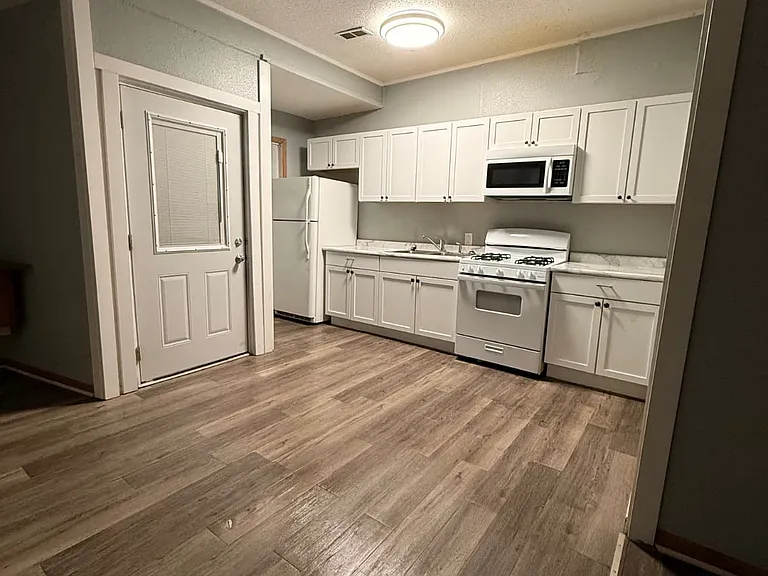 Entry door next to kitchen