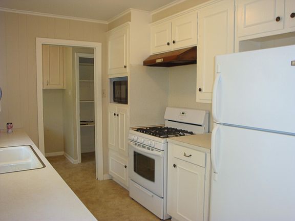 Kitchen and laundry room.  There is a washer and dryer in th