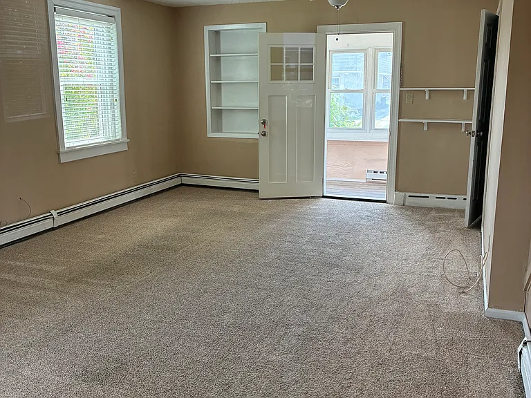 Lots of natural light in the living room, dining room and ceiling fan