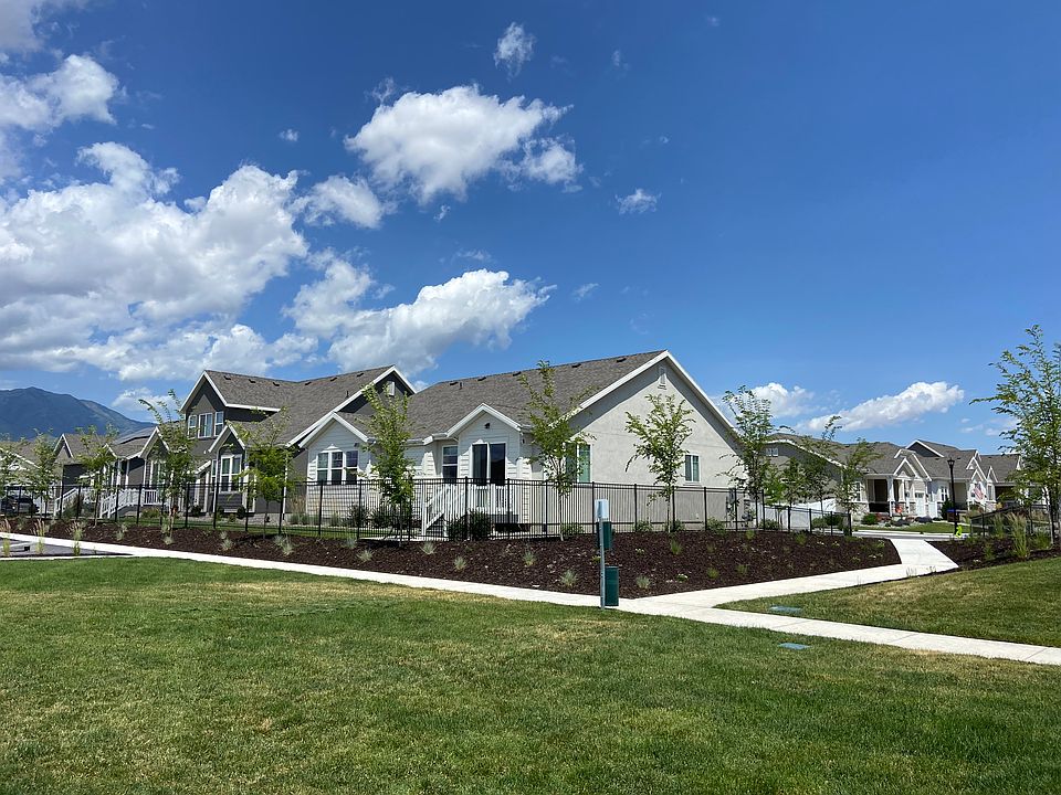 Back and side view of home location adjacent to walking paths and greenbelts