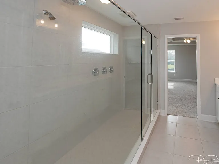Ridiculously large shower with waterfall head and 2 standard heads