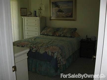 Master Bedroom : Large master has sliding doors leading to balcony & renovated tiled master bath.