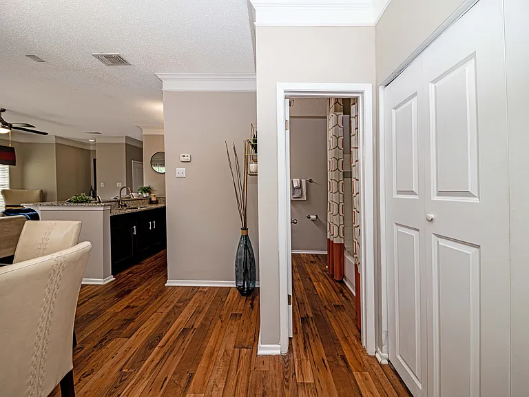 Hallway with hardwood-style flooring