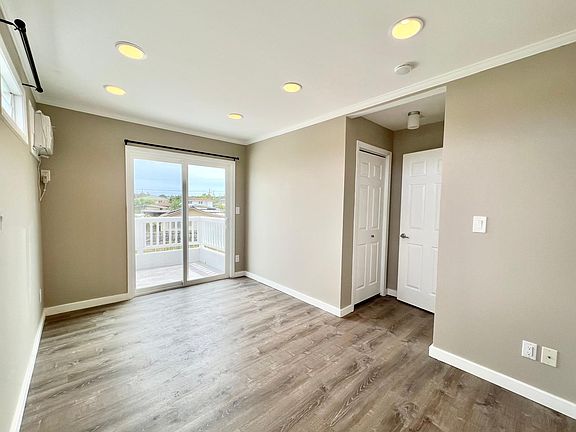 1st bedroom on second floor with lanai and closet.