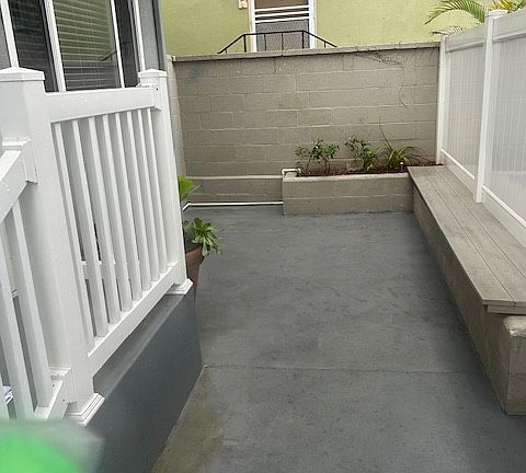 Patio in front of unit with seating bench- room for patio furniture set