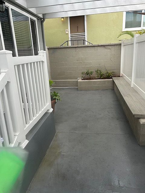 Patio in front of unit with seating bench- room for patio furniture set