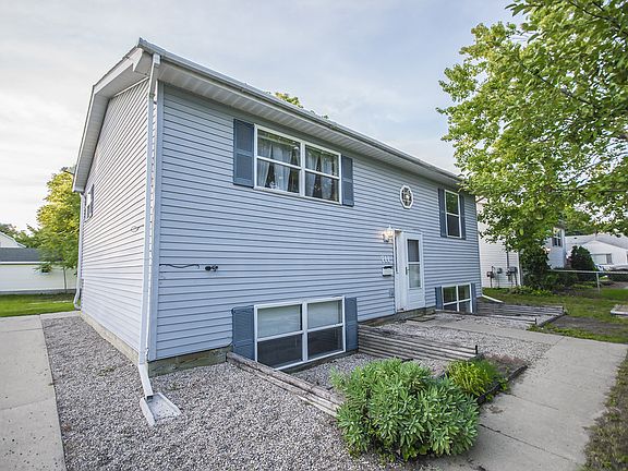 MAKING MEMORIES ON MILL!  This beautifully lit three bedroom, two full bath home with 1,800 square feet not only features a large eat-in kitchen, updated flooring, new hot water heater, large windows, ceiling fans throughout but also has a wonderful location convenient for you to walk to events in the downtown area!  