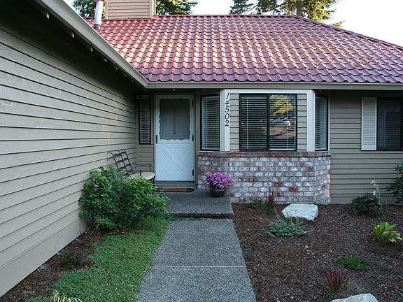 Front door to be replaced with dark wood grain, fully install, 20 yr warrenty