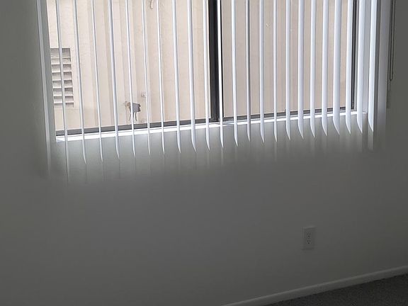 Sunny large bedroom. New grey carpeting and walk in closet!