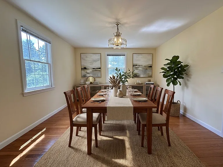 Virtually Staged. The main floor offers a formal living room with decorative fireplace, formal dining room, and cozy family room. The bright eat-in kitchen boasts stainless steel appliances, a BUILT-IN DESK, and sliders to a private deck and yard.