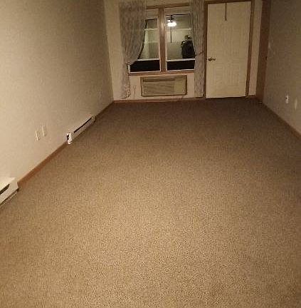 Living / Dining area. Please disregard the darkness of the room, as this photo was taken at night.