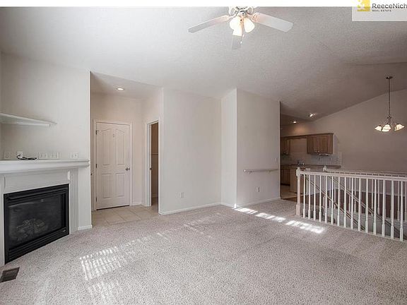 Tiled entry, coat closet, half bath and living room.