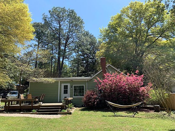 Back yard and deck with door to laundry room