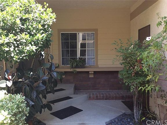 Front door is on the left and garage door is on the right, this is a covered area too. The windows a
