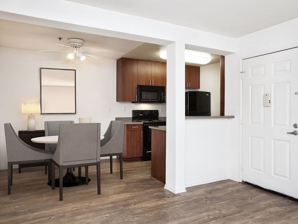Dining area and kitchen with hard surface flooring