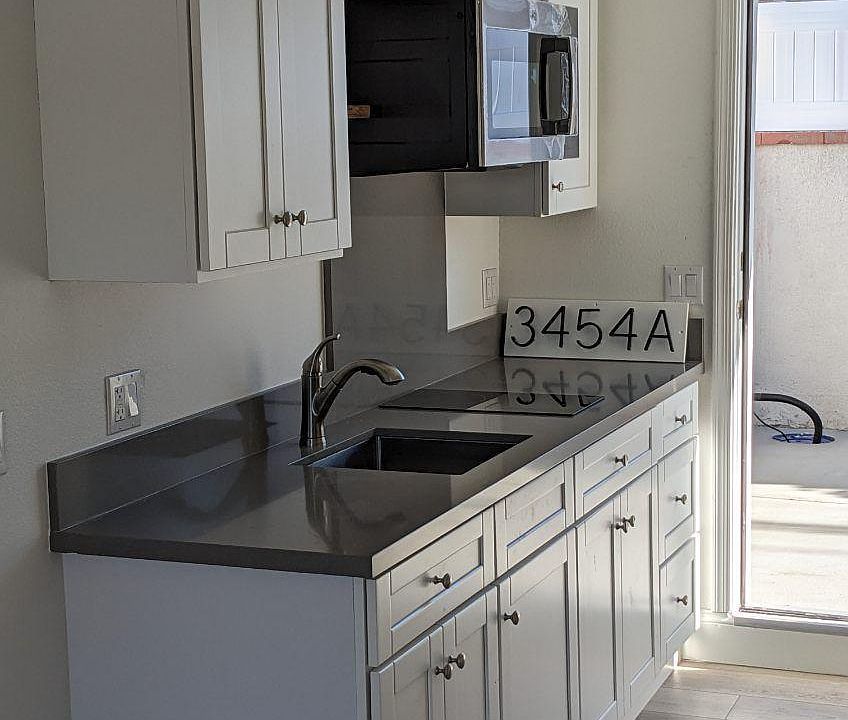 kitchen with sink, microwave, cooktop