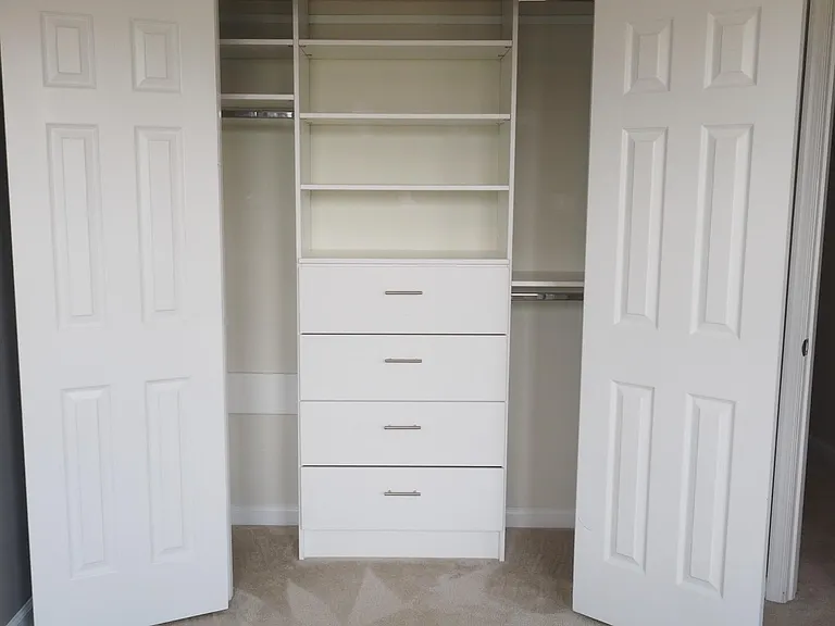 Large closet with shelves and drawers.