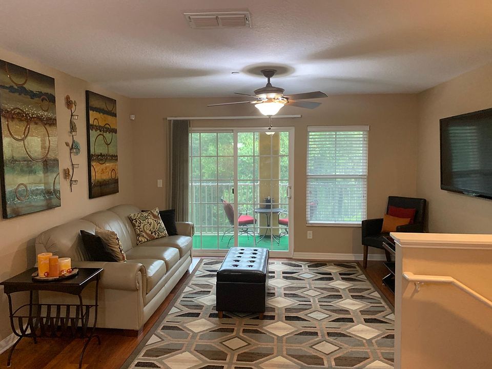 Charming Family Room with Screened-In Balcony - Nestled against serene woodlands, this space offers ultimate privacy and a tranquil retreat.