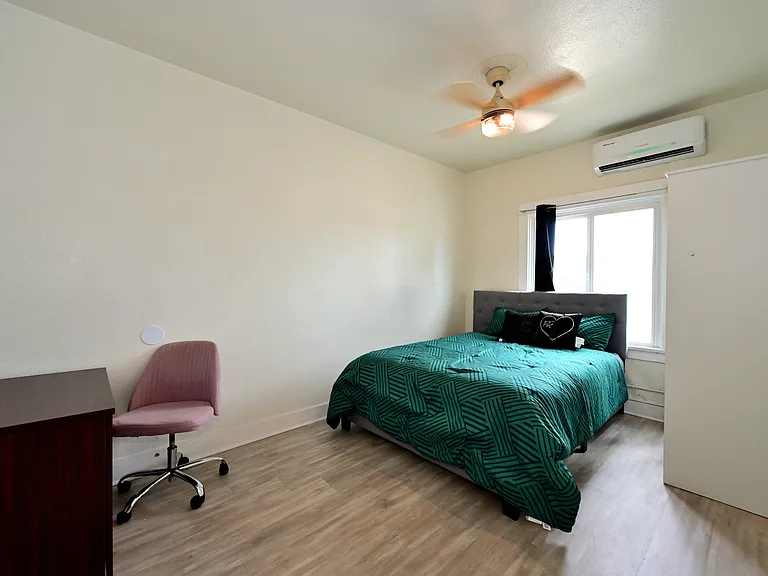 spacious and bright bedroom with furnishings + brand new ceiling fans and mini split AC