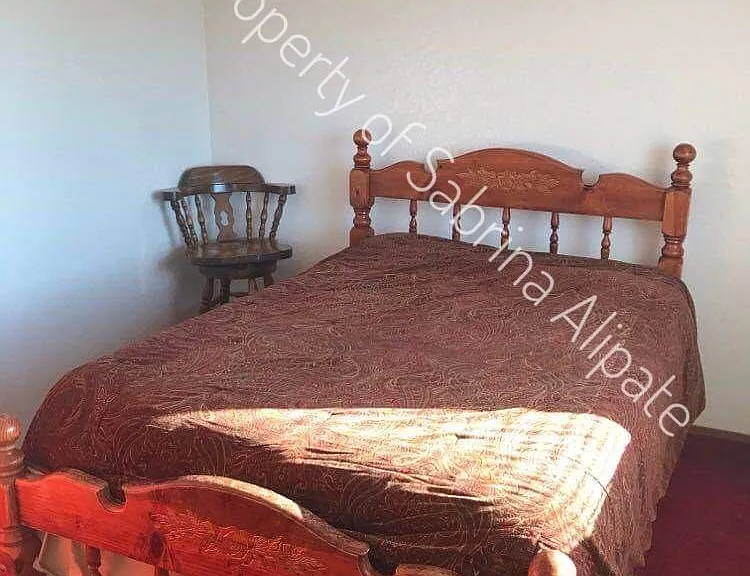 Upstairs bedroom facing water.